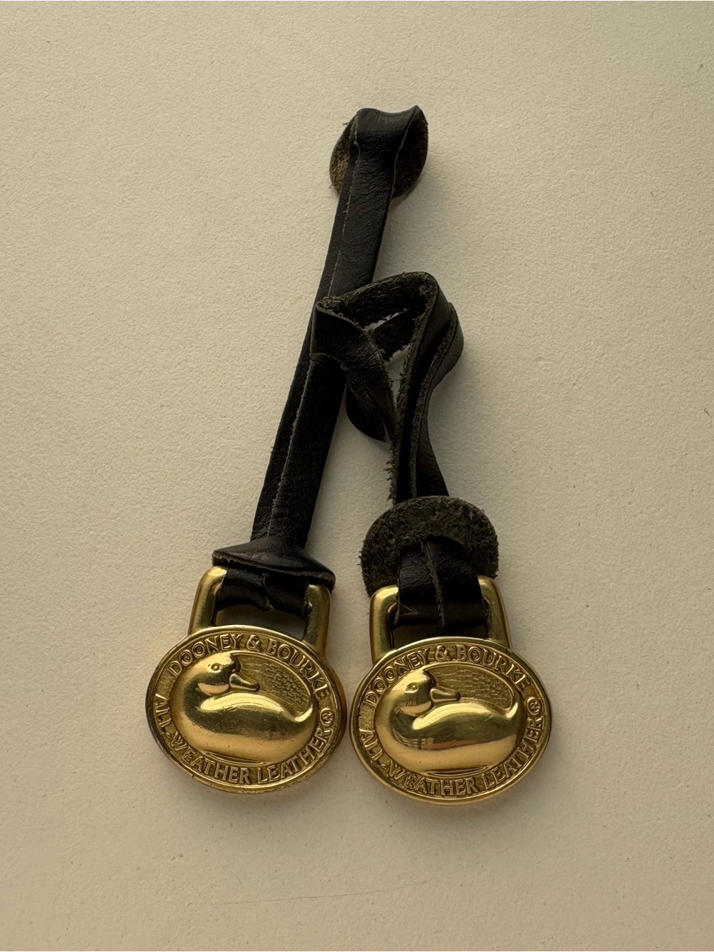 Dooney and Bourke 1990’s brass duck fob keychain hangtag